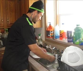 Crew member washing dishes