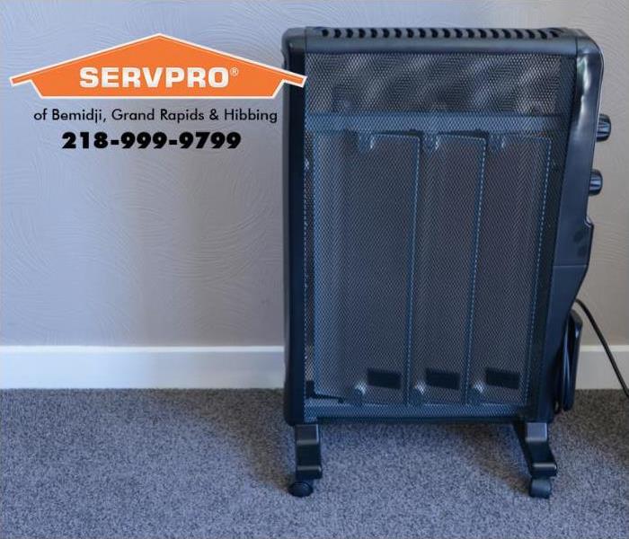A space heater is shown heating a room.